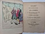 un vieux livre dans lequel figure la photo d'un groupe de personnes