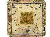 a small square plate with a painting on it
