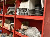 many shelves of assorted items in a garage