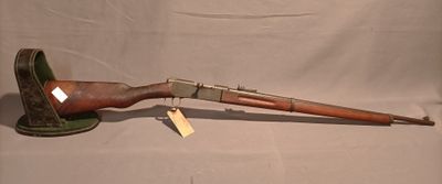 an old rifle with a wooden handle and a wooden handle