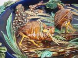 two bugs that are sitting in a bowl of water