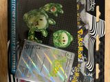 a box of pokemon trading cards on a wooden table