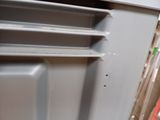 a close up of a refrigerator door with the door open