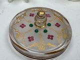 a silver and gold box with red and green beads