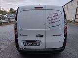 a white van that is parked on the side of the road