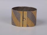 grey and gold woven cuff bracelet with gold metal clasp