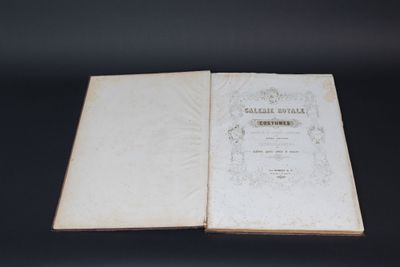 a close up of a book opened on a black surface