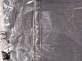 a pair of jeans wrapped in plastic on a table