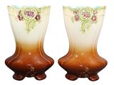 two vases with flowers painted on them on a white background