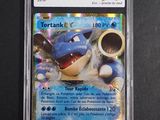 a close up of a pokemon trading card in a plastic case