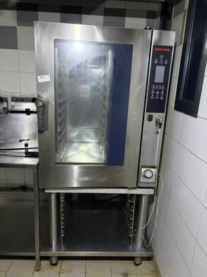 a commercial oven in a commercial kitchen with tile flooring