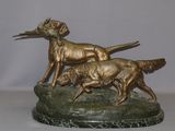 statue of two dogs on a marble base with a bird in the mouth