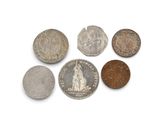 six different types of coins are shown on a white surface