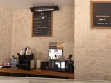 a picture of a coffee shop with a menu on the wall