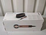 a box that has a hair brush inside of it