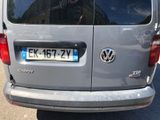 a silver van that is parked on the side of the road
