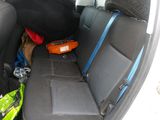 the back seats of a car with luggage in the back of it