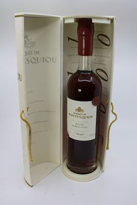 an open box with a bottle of wine in it on a table
