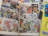 a comic book open on a table next to a computer mouse