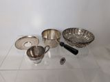 a glass table with a bowl, spoon, and other items on it