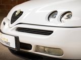 a white car that is parked in a garage