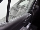a car that has a broken windshield and a broken window
