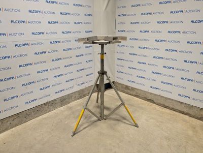 an image of a room with a table and a wall that has a sign on it