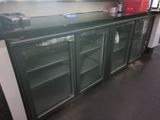 a black counter top with glass doors in a kitchen