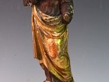 a statue of a woman that is standing on a pedestal