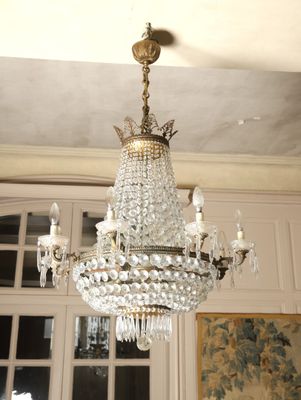 a chandelier hanging from the ceiling in a room