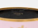 an image of a pink and gold vase with a gold rim