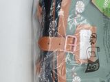 a bag of clothes that is wrapped up on a table