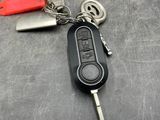 a keychain with a remote control attached to it