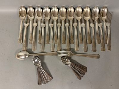 a lot of silver spoons and spoon spoons on the table