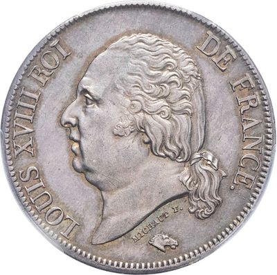 une vieille pièce d'argent sur laquelle figure le portrait d'un homme