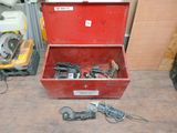 a red tool box sitting on the floor next to other tools