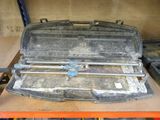 a metal tool case sitting on top of a table