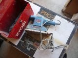 a box with a corded sander and a box with a corded sander on it