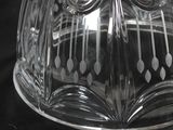a clear glass cake plate with an owl design on it