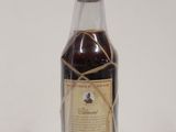 a bottle of liquor that is sitting on a table