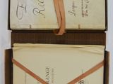 an open box with a note inside of it
