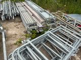 a lot of metal pipes and pipes on the ground