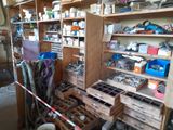 a room filled with lots of clutter and assorted items
