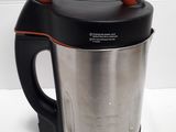 a black and silver blender with a red handle