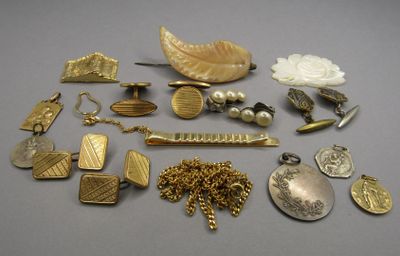 a lot of gold and silver jewelry on a table