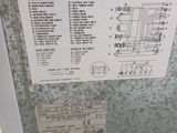 a metal box with a bunch of electrical wiring on it