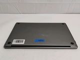 an open laptop computer sitting on top of a white surface