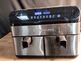 a close up of a coffee maker on a table