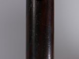 a close up of a wooden pole with a black handle