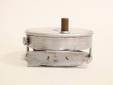 a small metal object that is on a white surface